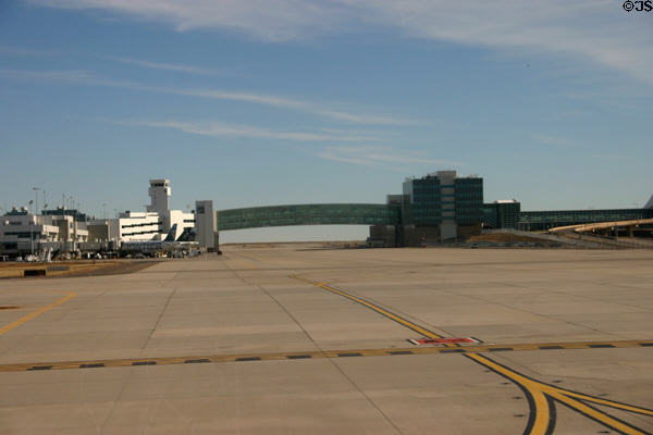 Glass walkway between terminals at Denver airport. Denver, CO.