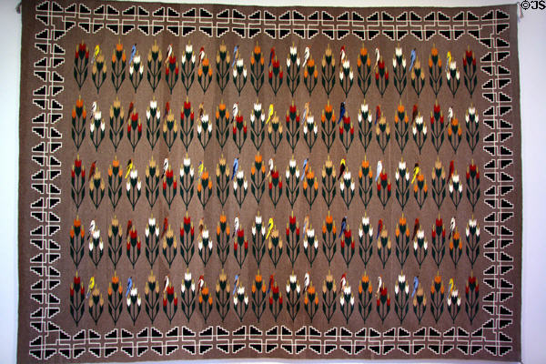 Navajo wool rug (1984) with plant & bird design by Ason Yellowhair at Denver Art Museum. Denver, CO.