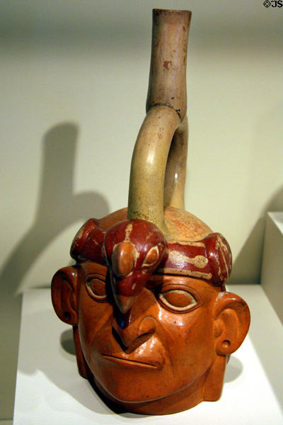 Moche stirrup-spout earthenware portrait bottle (300-600) from North Coast of Peru at Denver Art Museum. Denver, CO.