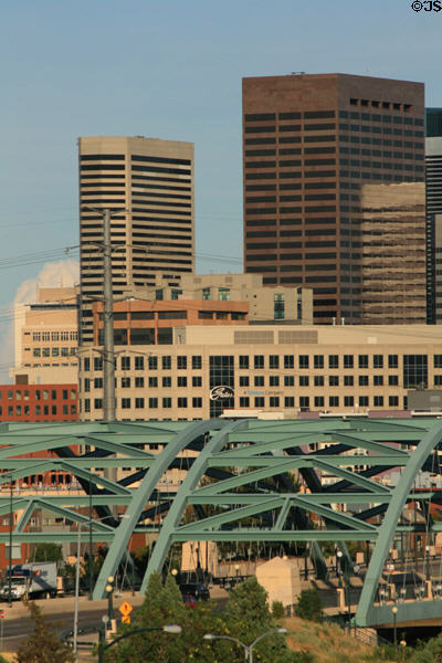 Steel arches of Speer Boulevard Bridge with Denver skyline. Denver, CO.