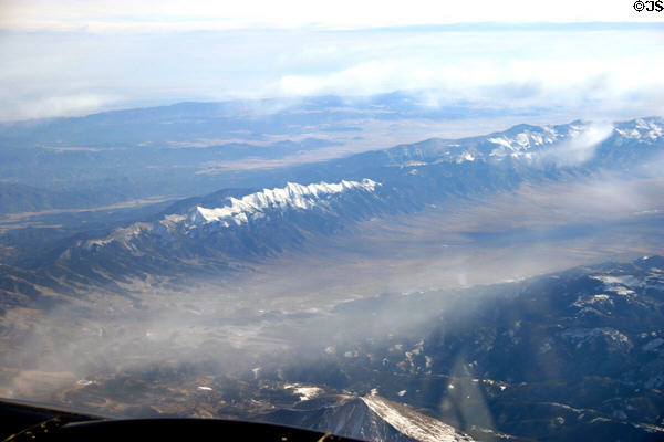 Rugged peaks of chain in Rocky Mountains from air. CO.