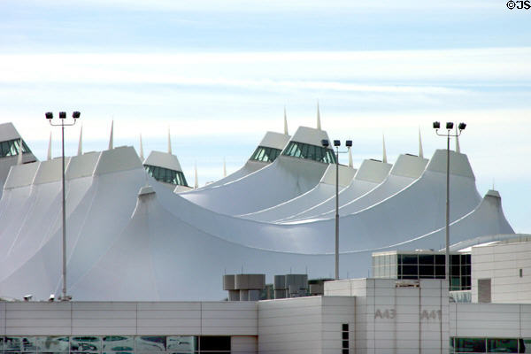 Jeppesen Terminal at Denver International Airport with a roof of Teflon-coated fiberglass which mimics the distant Rocky Mountains. Denver, CO.