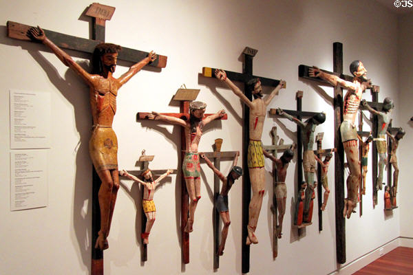 Collection of Santos art crucifixes (1820-1910) by various Hispanic artists at Colorado Springs Fine Arts Center. Colorado Springs, CO.