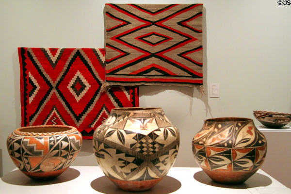 Navajo rugs (c1900) & Acoma polychrome pottery jars at Colorado Springs Fine Arts Center. Colorado Springs, CO.