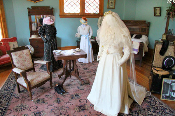 Bedroom with display of antique clothing at Miramont Castle. Manitou Springs, CO.