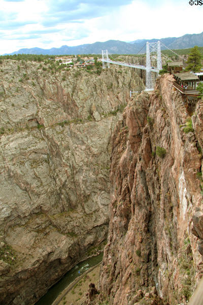 Suspension bridge over Royal Gorge with river below. CO.