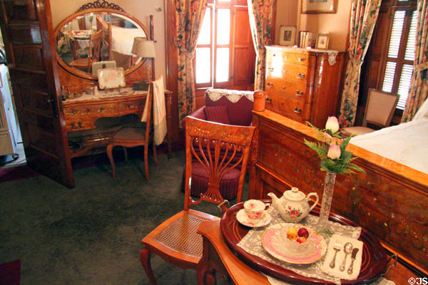 Bedroom with vanity, chair & breakfast tray at Rosemount House Museum. Pueblo, CO.