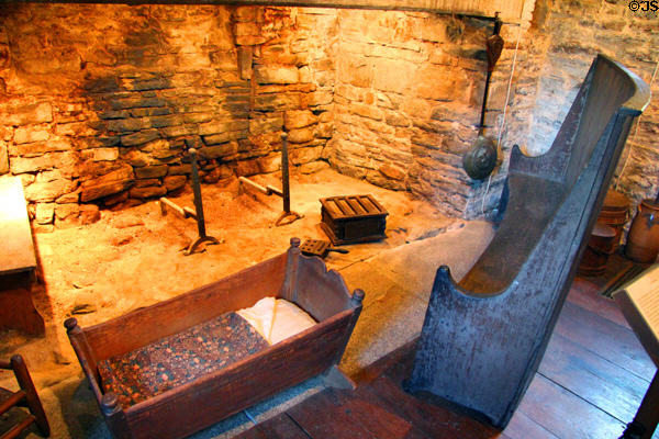 Cradle & settle before fireplace at Henry Whitfield State Museum. Guilford, CT.