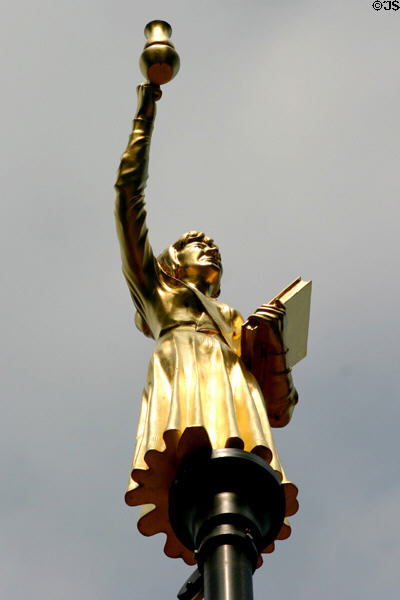 Woman with lamp, one of series of gilded statues on poles surrounding Old State House. Hartford, CT.