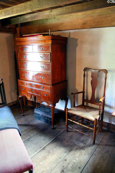 Tall chest of drawers with half-arm chair at Stanley-Whitman House. Farmington, CT.