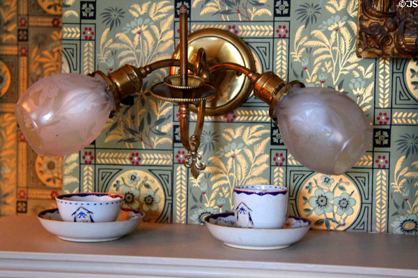 Light fixture over Chinese porcelain cup & tea caddy (c1790) owned by Patty Olcott Butler with his initials (PB) at Butler-McCook House Museum. Hartford, CT.