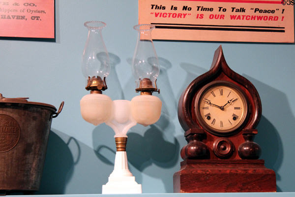 Opaque glass double kerosene lamp & shelf clock (c1880) by E. Ingraham & Co. of Bristol, CT at Connecticut Historical Society. Hartford, CT.