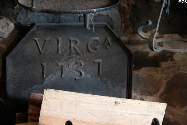 Cast iron fireplace back protector (1737) from Virginia at Noah Webster House. West Hartford, CT.