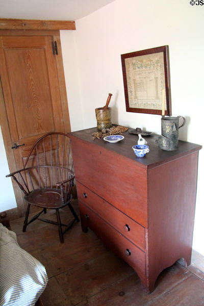 Chest with drawers with Windsor chair& tin lantern at Strong House. Windsor, CT.