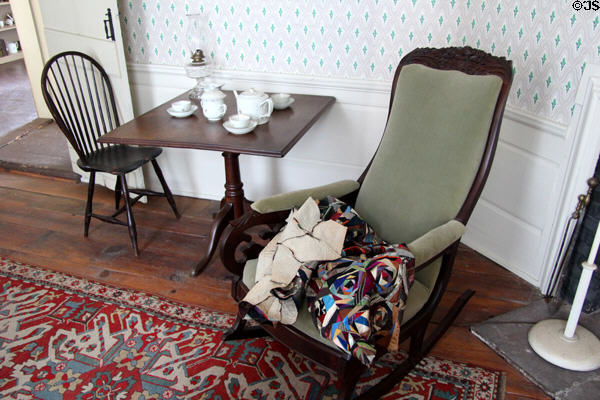 Upholstered rocking chair with tea table at Strong House. Windsor, CT.