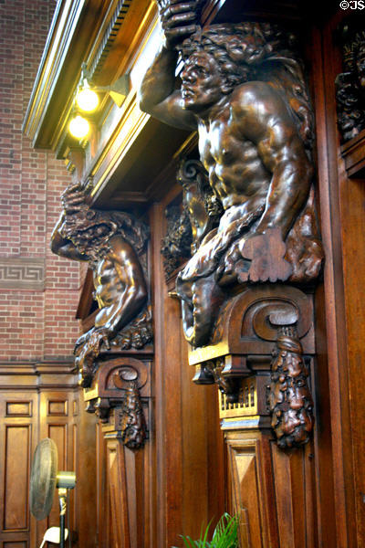 Carved wooden figures on the walls of the dining room of University Commons. New Haven, CT.