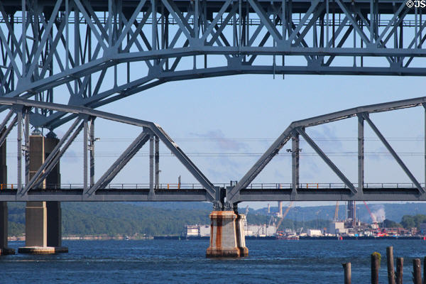 Details of Interstate highway & rail bridge over Thames River with Submarine naval yard beyond. Groton, CT.