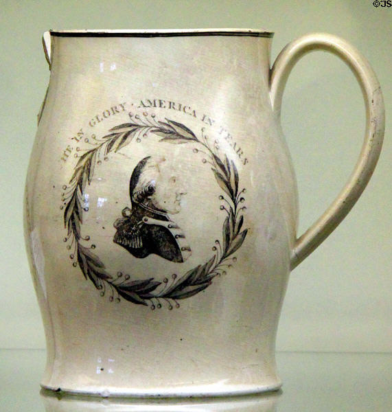 Commemorative creamware pitcher with image of George Washington in Glory, America in Tears at Monument House Museum. Groton, CT.