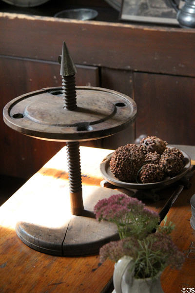 Adjustable height wooden candle stick to keep light at right level at Judson House. Stratford, CT.