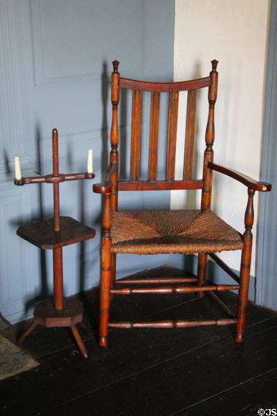 Caned armchair with adjustable-height candle stand at Judson House. Stratford, CT.