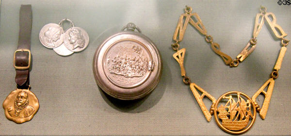 Columbus-themed watch fobs, pocket watch & pendants (all c1892) at Knights of Columbus Museum. New Haven, CT.