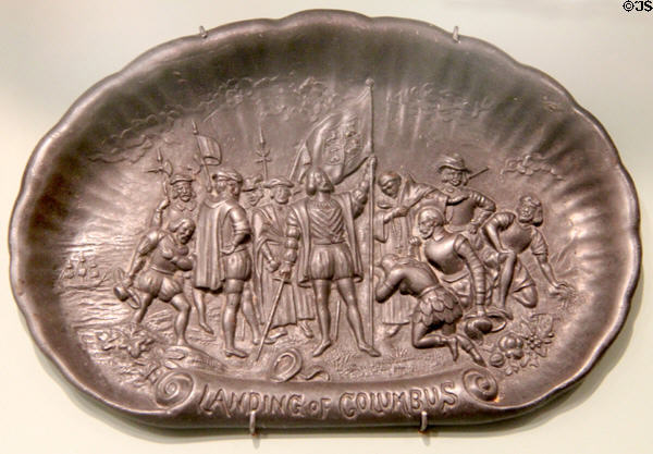 Souvenir cast iron dresser tray with scene of landing of Columbus from Chicago World Columbian Exposition (1893) at Knights of Columbus Museum. New Haven, CT.