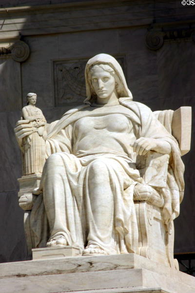 Sculpture of seated woman holding Athena in front of Supreme Court building. Washington, DC.