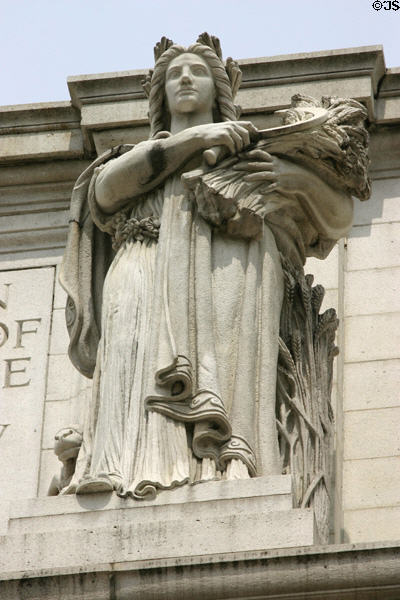 Sculpture of woman harvesting wheat on Union Station. Washington, DC.