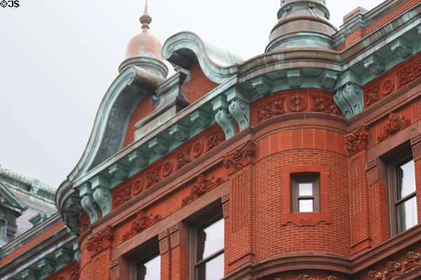 Sun Trust Bank swan-neck pediment in copper & red brick. Washington, DC.