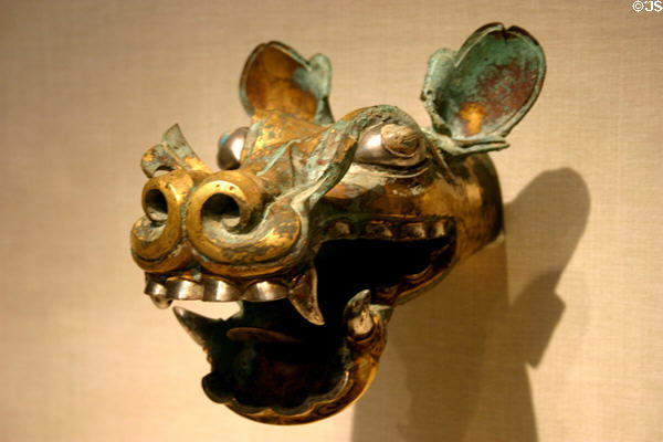 Bronze, silver, gold chariot fitting in canine shape from Eastern Zhou dynasty of China (300-250 BCE) in Sackler Gallery. Washington, DC.