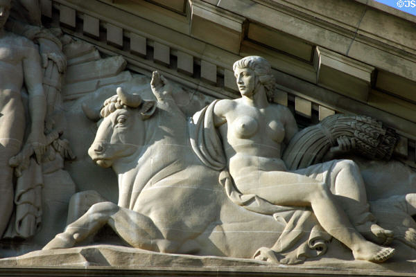 Pediment detail showing woman with wheat on back of bull on EPA Building. Washington, DC.
