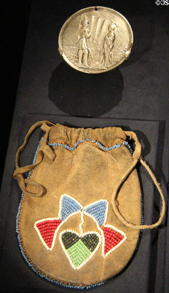Medal with native designs & beaded pouch at National Museum of the American Indian. Washington, DC.