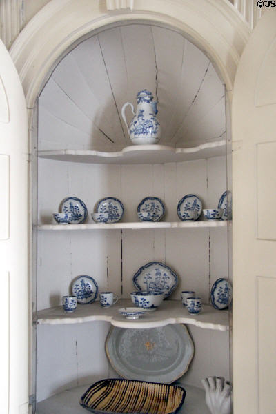 Corner cabinet with porcelain coffee service at Old Stone House. Washington, DC.