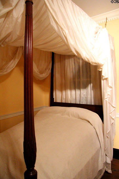 Mahogany "rice bed" bedstead (c1800) made in Charleston draped in mosquito tenting pavilion n South Carolina period bedchamber at DAR Memorial Continental Hall. Washington, DC.