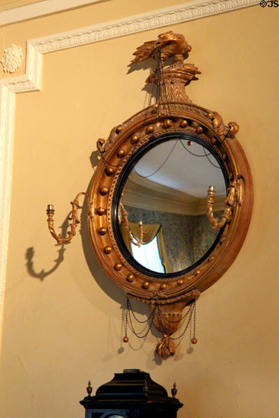 Convex looking glass with carved eagle (c1820) in New York period parlor (1820s) at DAR Memorial Continental Hall. Washington, DC.