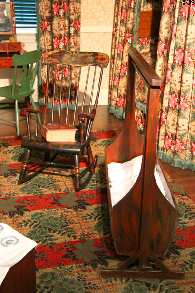 Rocking chair (c1869) & hanging cradle (c1870) in Illinois period bedroom (1840s) at DAR Memorial Continental Hall. Washington, DC.