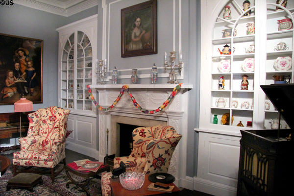 Wall cabinets with collection of glass & porcelain in Ohio period parlor at DAR Memorial Continental Hall. Washington, DC.