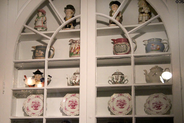Collection of pitchers (early 19thC) & Toby jugs in Ohio period parlor at DAR Memorial Continental Hall. Washington, DC.