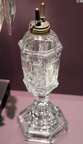 Pressed glass whale oil lamp in Lyre pattern (1850-75) by Boston & Sandwich Glass Co., Sandwich, MA at DAR Memorial Continental Hall Museum. Washington, DC.