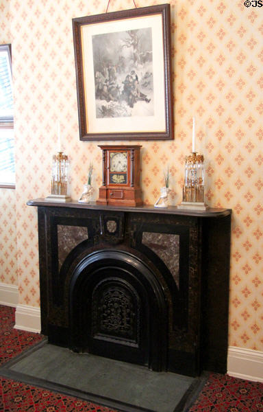 Parlor fireplace with mantle clock in House Where Lincoln Died. Washington, DC.