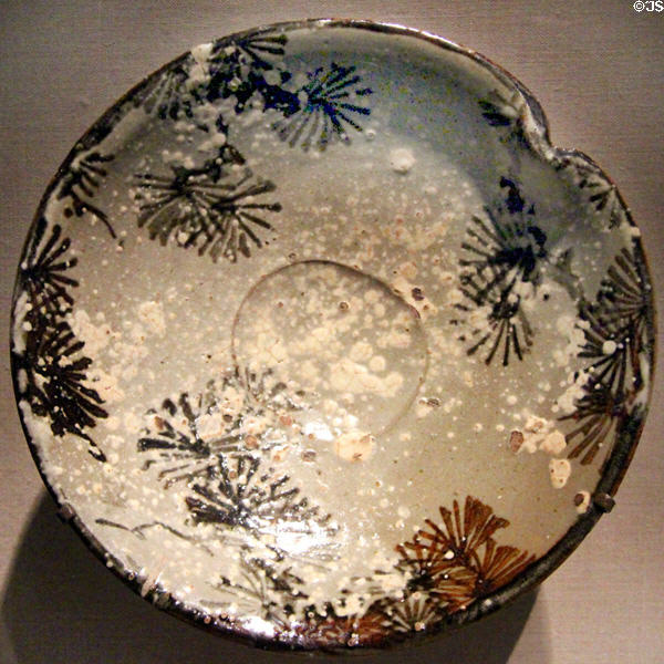 Japanese stoneware dish with design of pines in snow (early 19thC) by Kiyomizu Rokubei II at Smithsonian Freer Gallery of Art. Washington, DC.
