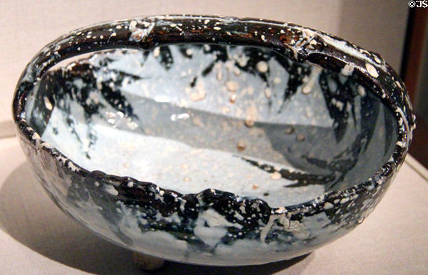 Japanese stoneware bowl with design of bamboo grass in snow (early 19thC) by Nin'ami Dohachi at Smithsonian Freer Gallery of Art. Washington, DC.