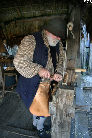 Carpenter turn wood on treadle lathe at Colonial Spanish Quarter Museum. St Augustine, FL.
