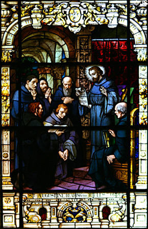 Stained glass window of St Augustine rules to his order in Cathedral. St Augustine, FL.