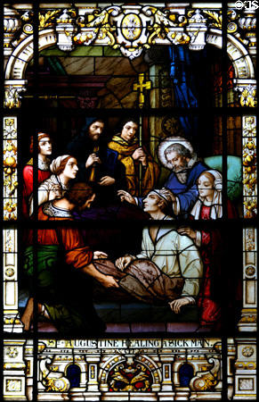 Stained glass window of St Augustine healing a sick man in Cathedral. St Augustine, FL.