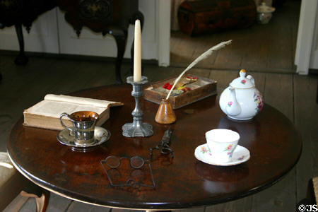 Table with early American objects in The Oldest House. St Augustine, FL.