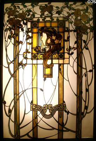 Austrian Art Nouveau colored glass window (c1900) with woman's profile & vines at Lightner Museum. St Augustine, FL.