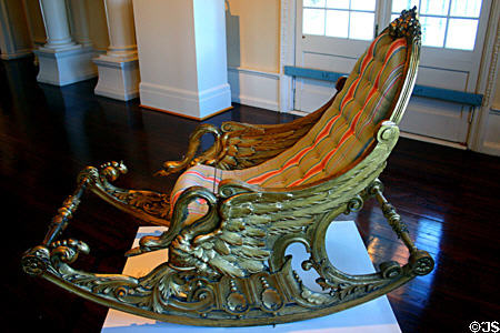 English Regency swan rocking chair in gilded wood (19thC) at Lightner Museum. St Augustine, FL.