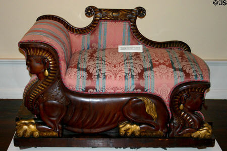 Renaissance-Revival lounge chair resting on Egyptian-style sphinxes (1860-70) from New York at Lightner Museum. St Augustine, FL.