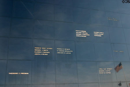 Reflective wall with names of Astronauts who lost their lives on Memorial at Kennedy Space Center. FL.